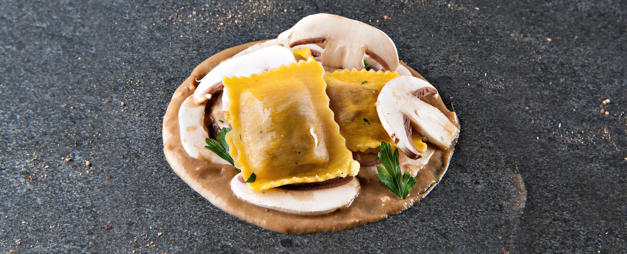 Ravioli-with-mushrooms-on-cream-of-porcini-and-carpaccio-of-champignon-1